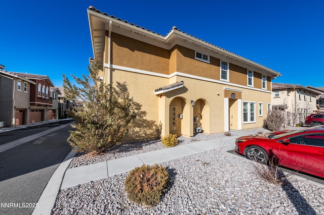 1845 Sea Horse Rd Unit C, Reno, NV 89521 - view of front facade with stucco siding and a residential view