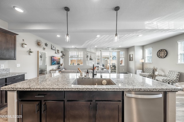 1845 Sea Horse Rd Unit C, Reno, NV 89521 - kitchen with stainless steel dishwasher, open floor plan, a sink, dark brown cabinetry, and recessed lighting