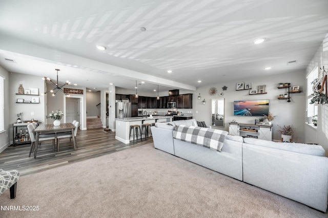 1845 Sea Horse Rd Unit C, Reno, NV 89521 - living room featuring plenty of natural light, a chandelier, recessed lighting, baseboards, and carpet flooring