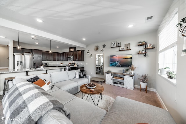 1845 Sea Horse Rd Unit C, Reno, NV 89521 - living area featuring light carpet, baseboards, and recessed lighting