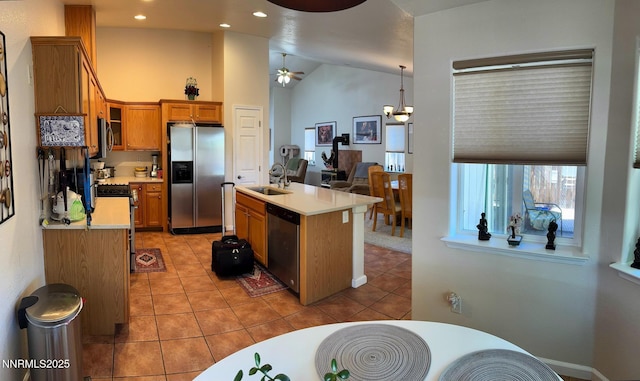 1332 Brooke Way, Gardnerville, NV 89410 - kitchen featuring stainless steel appliances, light countertops, brown cabinetry, ceiling fan, and light tile patterned floors