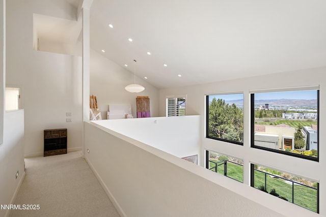 2260 Stone Mountain Cir, Reno, NV 89519 - hallway with high vaulted ceiling, recessed lighting, baseboards, an upstairs landing, and light colored carpet
