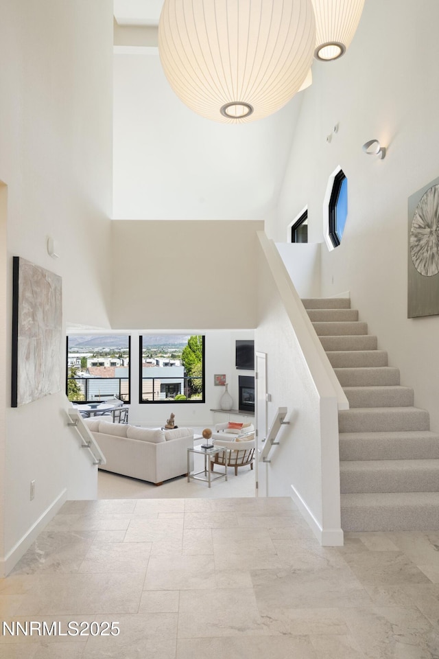 2260 Stone Mountain Cir, Reno, NV 89519 - stairs featuring a high ceiling and baseboards