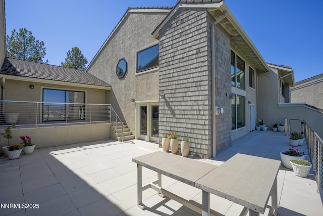 2260 Stone Mountain Cir, Reno, NV 89519 - back of house with a patio area and stucco siding