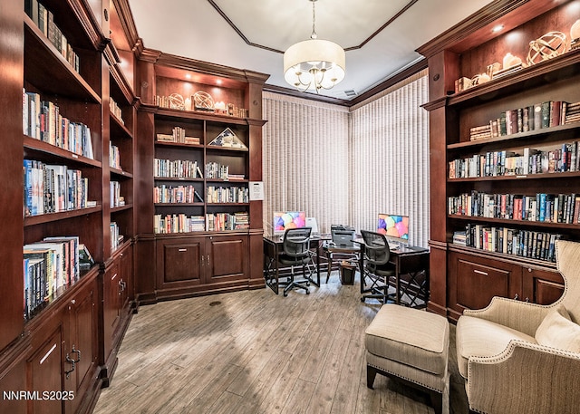 900 S Meadows Pkwy Unit 3922, Reno, NV 89521 - home office with a chandelier, wood finished floors, ornamental molding, and wall of books