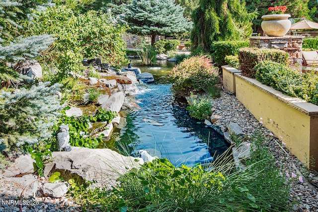 900 S Meadows Pkwy Unit 3922, Reno, NV 89521 - view of swimming pool featuring a garden pond