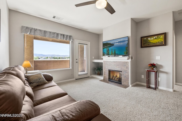 900 S Meadows Pkwy Unit 3922, Reno, NV 89521 - living room with carpet, a ceiling fan, a fireplace, and baseboards