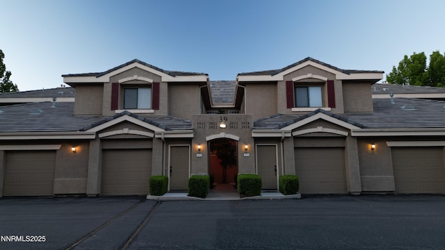 900 S Meadows Pkwy Unit 3922, Reno, NV 89521 - townhome / multi-family property with a tiled roof and stucco siding
