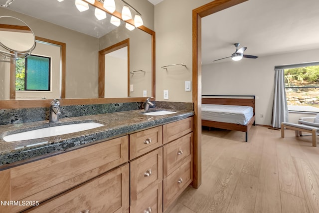 2593 Chaparral Ct, Reno, NV 89509 - ensuite bathroom featuring double vanity, wood finished floors, and a ceiling fan