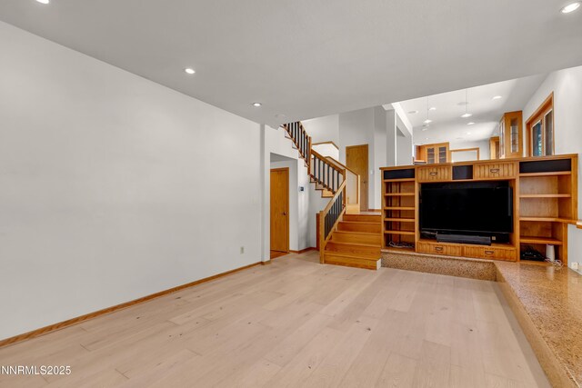 2593 Chaparral Ct, Reno, NV 89509 - unfurnished living room with recessed lighting, stairway, light wood finished floors, and baseboards