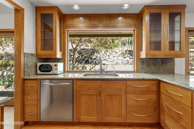 2593 Chaparral Ct, Reno, NV 89509 - kitchen featuring dishwasher, a sink, light stone counters, decorative backsplash, and recessed lighting