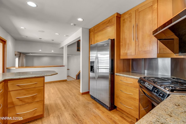 2593 Chaparral Ct, Reno, NV 89509 - kitchen featuring stainless steel fridge, light wood finished floors, range with gas cooktop, light stone countertops, and recessed lighting