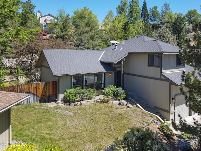2593 Chaparral Ct, Reno, NV 89509 - view of front facade with a shingled roof and a garage