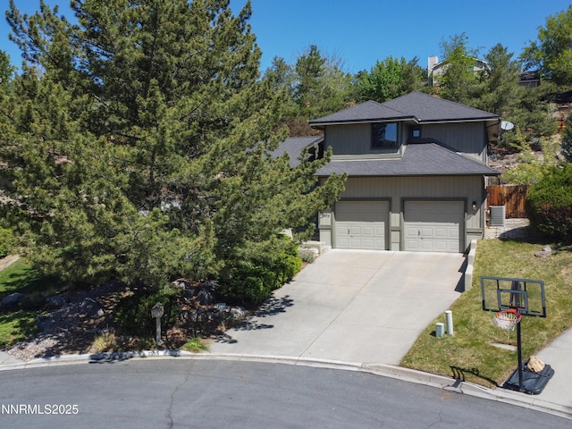 2593 Chaparral Ct, Reno, NV 89509 - view of front of home featuring concrete driveway and a garage