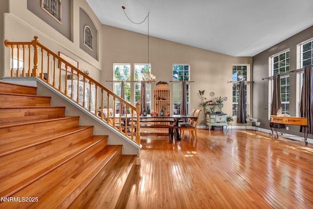 3201 Green River Dr, Reno, NV 89503 - entrance foyer featuring plenty of natural light, hardwood / wood-style flooring, a chandelier, stairs, and high vaulted ceiling