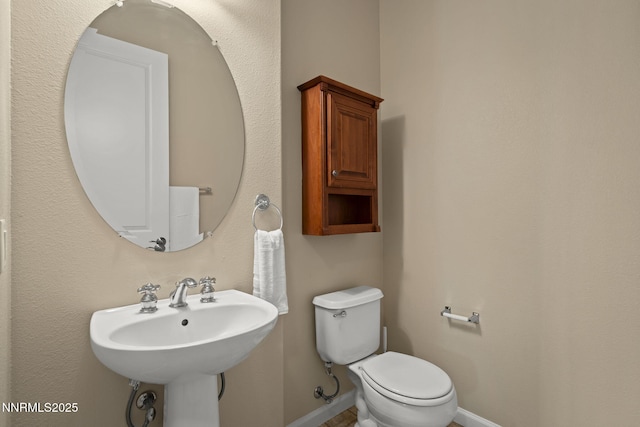 9900 Wilbur May Pkwy Unit 2406, Reno, NV 89521 - bathroom with baseboards, toilet, and a sink