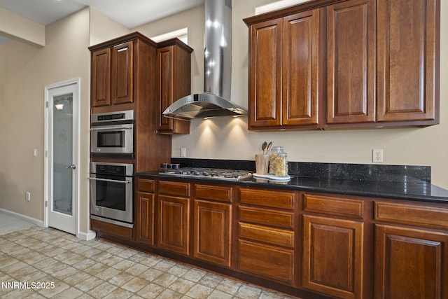 9900 Wilbur May Pkwy Unit 2406, Reno, NV 89521 - kitchen with wall chimney exhaust hood, appliances with stainless steel finishes, baseboards, and dark stone countertops