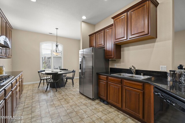 9900 Wilbur May Pkwy Unit 2406, Reno, NV 89521 - kitchen featuring stainless steel appliances, a sink, dark countertops, hanging light fixtures, and recessed lighting