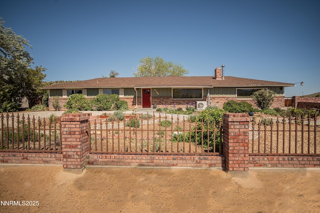 9100 Wigwam Way, Reno, NV 89506 - ranch-style house with brick siding, a chimney, and board and batten siding