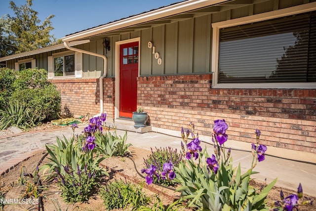 9100 Wigwam Way, Reno, NV 89506 - entrance to property with board and batten siding and brick siding