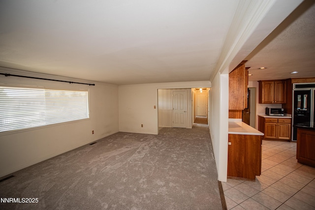 9100 Wigwam Way, Reno, NV 89506 - unfurnished living room featuring baseboards, light carpet, and crown molding