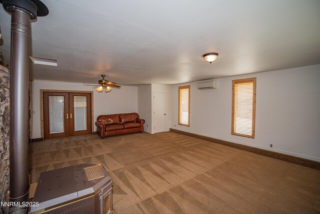 9100 Wigwam Way, Reno, NV 89506 - unfurnished living room featuring a wall mounted AC, carpet floors, ceiling fan, and baseboards