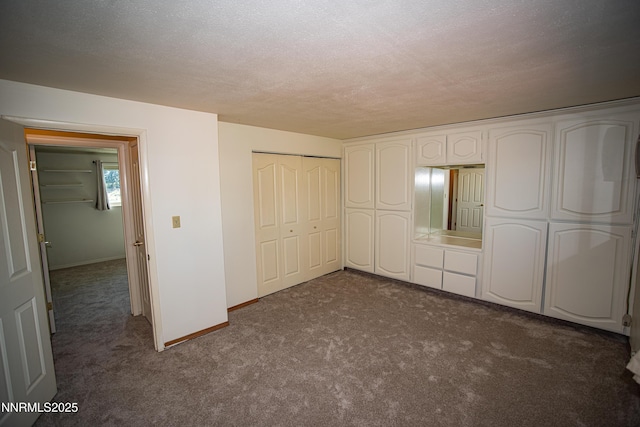 9100 Wigwam Way, Reno, NV 89506 - unfurnished bedroom featuring dark colored carpet, baseboards, and a closet