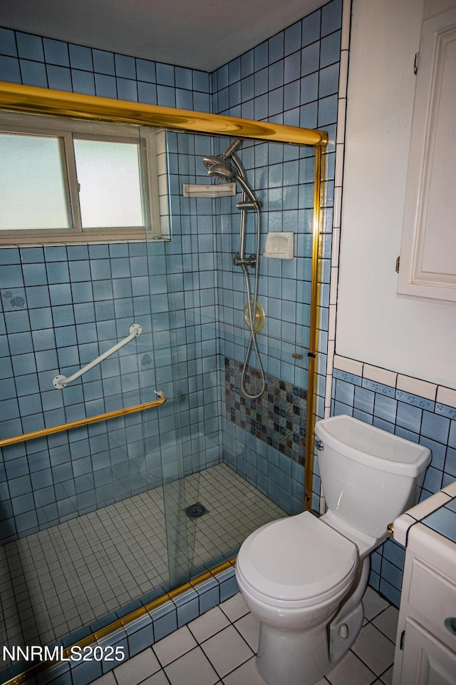 9100 Wigwam Way, Reno, NV 89506 - full bath with toilet, tile patterned floors, tile walls, and a stall shower