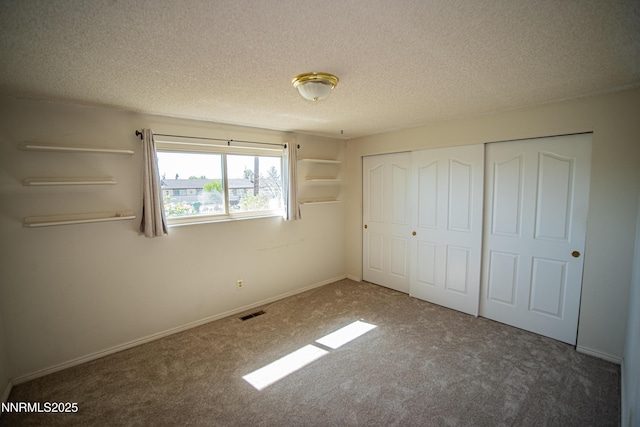9100 Wigwam Way, Reno, NV 89506 - unfurnished bedroom with carpet flooring, a closet, a textured ceiling, and baseboards