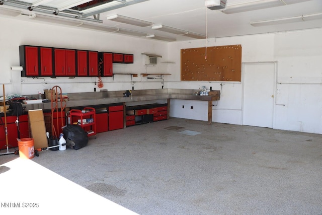 9100 Wigwam Way, Reno, NV 89506 - garage with a garage door opener and a workshop area