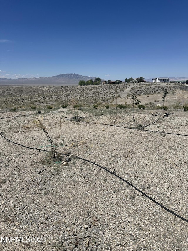 2068 NE Sierra Vista Dr, Tonopah, NV 89049 - view of yard featuring a mountain view, view of desert, and a rural view