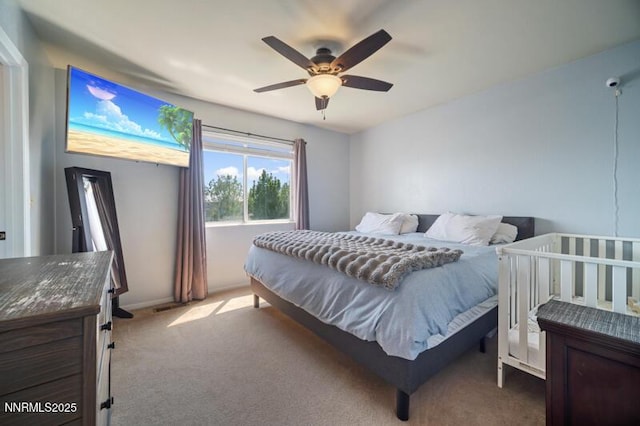 1061 Aimee Ln, Fallon, NV 89406 - carpeted bedroom featuring a ceiling fan