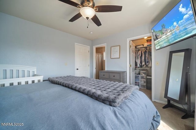 1061 Aimee Ln, Fallon, NV 89406 - bedroom with carpet flooring, a walk in closet, a closet, ceiling fan, and baseboards
