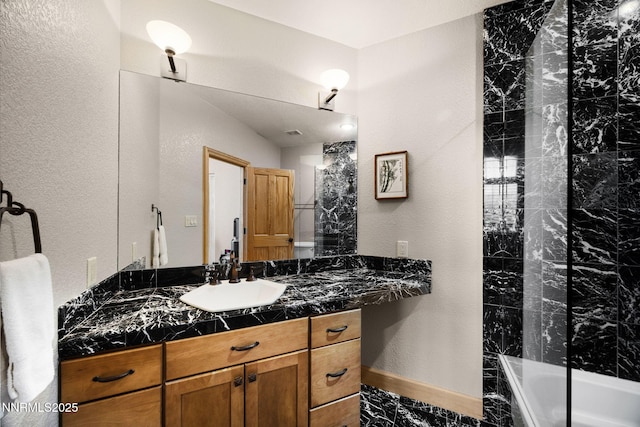 14501 Quail Rock Ct, Reno, NV 89511 - full bathroom featuring vanity, a textured wall, and baseboards