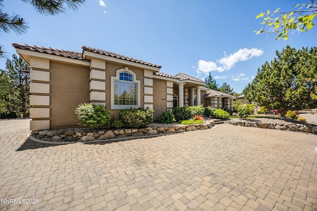 14501 Quail Rock Ct, Reno, NV 89511 - mediterranean / spanish-style house with stucco siding and a tiled roof