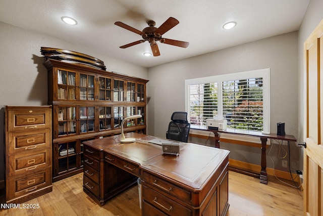 14501 Quail Rock Ct, Reno, NV 89511 - home office featuring ceiling fan, light wood finished floors, recessed lighting, and baseboards
