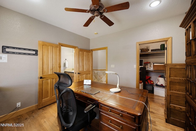 14501 Quail Rock Ct, Reno, NV 89511 - office with light wood-style flooring, a ceiling fan, and baseboards