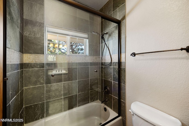 14501 Quail Rock Ct, Reno, NV 89511 - full bathroom with toilet,  shower combination, and a textured wall