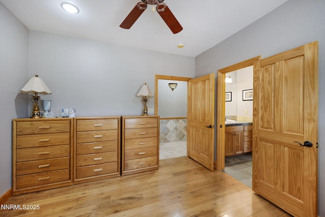14501 Quail Rock Ct, Reno, NV 89511 - bedroom featuring light wood-style floors, ensuite bath, and a ceiling fan