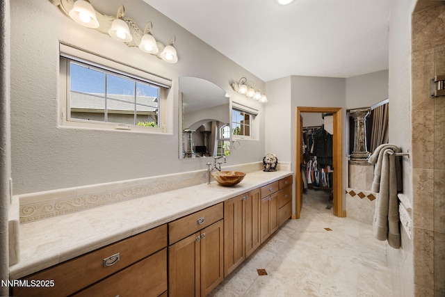14501 Quail Rock Ct, Reno, NV 89511 - full bathroom with vanity and a walk in closet