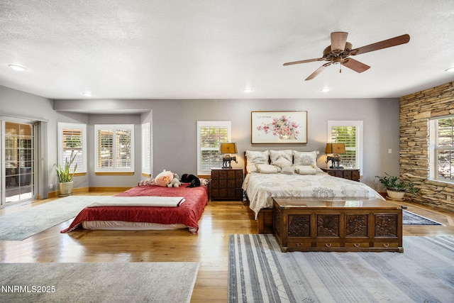 14501 Quail Rock Ct, Reno, NV 89511 - bedroom featuring access to outside, wood finished floors, multiple windows, recessed lighting, and ceiling fan