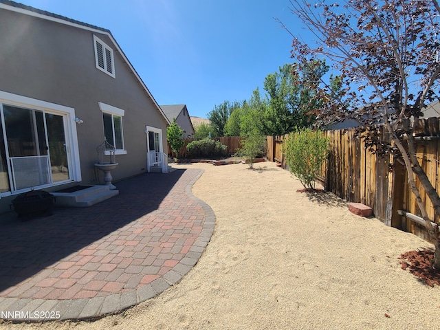 580 Boulder Peak Ct, Sparks, NV 89436 - fenced backyard with a patio and entry steps