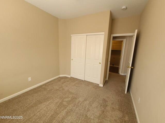 580 Boulder Peak Ct, Sparks, NV 89436 - unfurnished bedroom with carpet, a closet, and baseboards