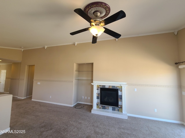 580 Boulder Peak Ct, Sparks, NV 89436 - unfurnished living room featuring carpet, a ceiling fan, crown molding, baseboards, and a glass covered fireplace