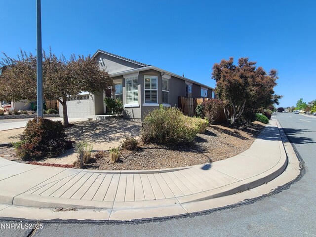 580 Boulder Peak Ct, Sparks, NV 89436 - view of front facade featuring stucco siding and an attached garage