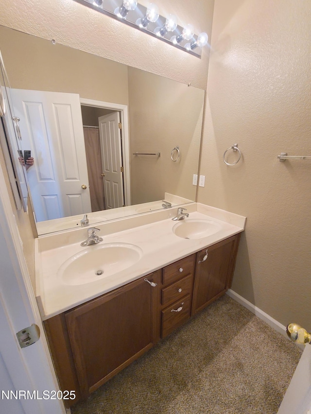 580 Boulder Peak Ct, Sparks, NV 89436 - bathroom with double vanity and baseboards