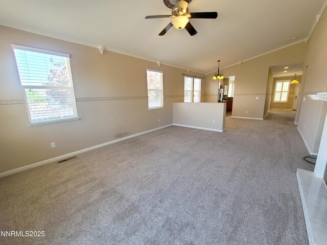 580 Boulder Peak Ct, Sparks, NV 89436 - empty room with ornamental molding, ceiling fan, baseboards, vaulted ceiling, and carpet floors