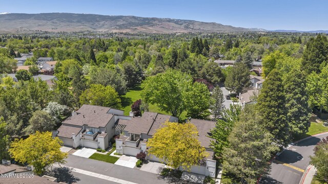 4307 Clyde Ct, Reno, NV 89509 - aerial view of property and surrounding area with nearby suburban area, a mountain backdrop, and a forest