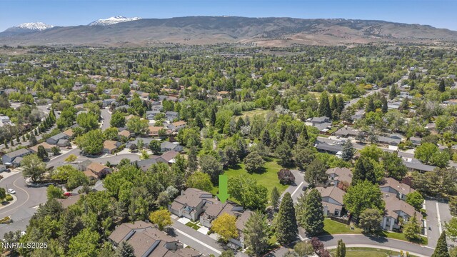 4307 Clyde Ct, Reno, NV 89509 - aerial view of property's location featuring a mountainous background and nearby suburban area