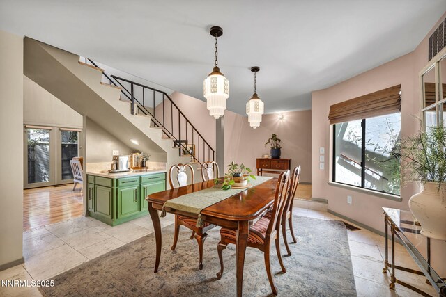 4307 Clyde Ct, Reno, NV 89509 - dining area with plenty of natural light, stairs, and baseboards